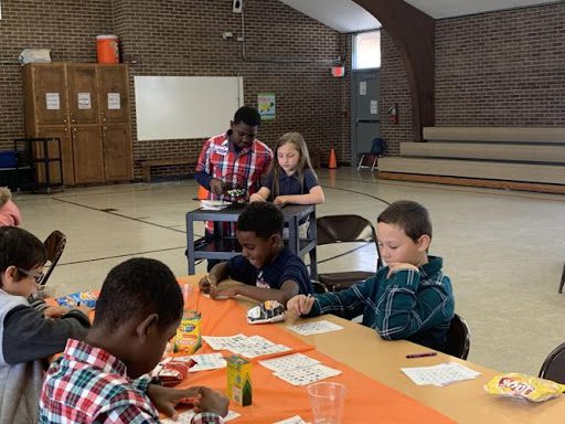 Bingo students playing themed bingo in this example of pep rally activities.