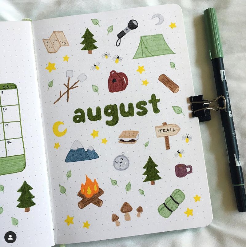 Bullet journal page with a camping theme for the month of August