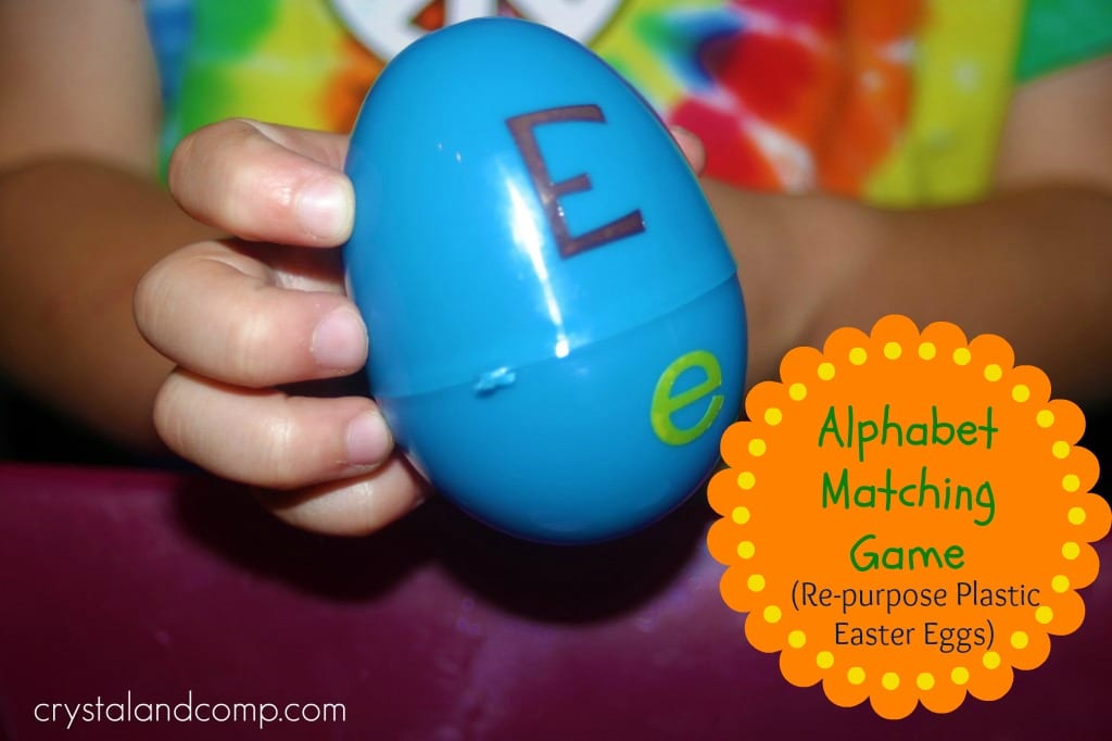easter-egg-alphabet-game A child's hand holds a blue plastic Easter egg with a capital E written on the top half and a lowercase e on the bottom half as an example of alphabet activities