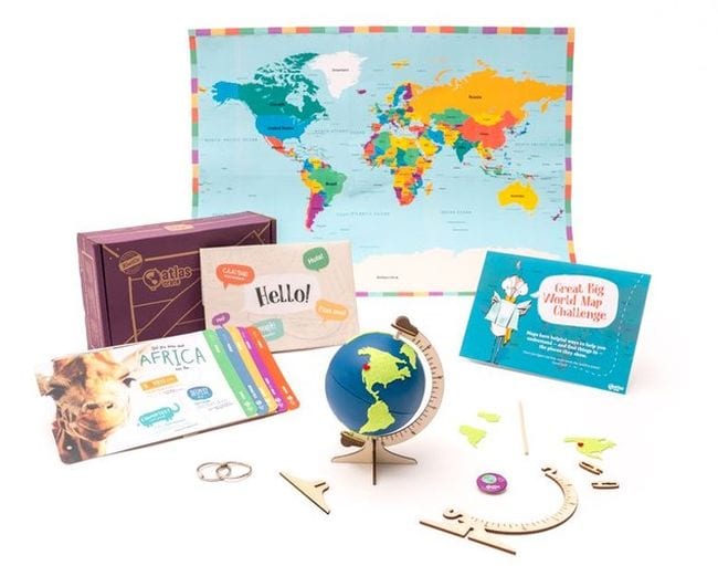 Educational Subscription Boxes Atlas Crate Array of geography learning items including a small globe from KiwiCo Atlas Crates educational subscription boxes