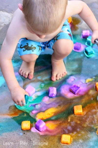 Boy playing with chalk