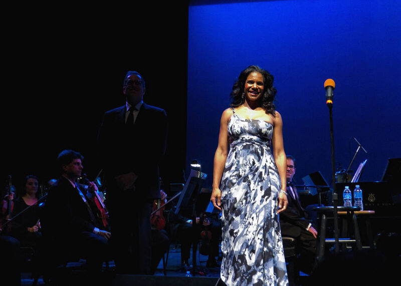 Famous People with ADHD Audra McDonald on stage in gown