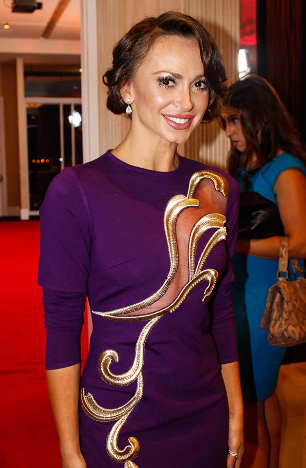 Famous People with ADHD Karina Smirnoff on the red carpet wearing a purple dress