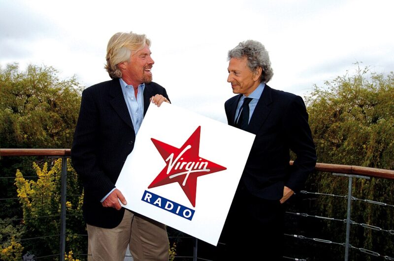 Famous People with ADHD Richard Branson with Virgin Radio sign