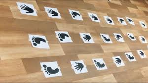 Hopscotch Print-outs of hands and feet on floor
