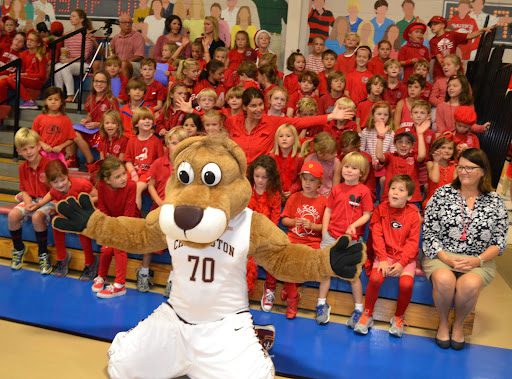 Mascot School mascot posing with students