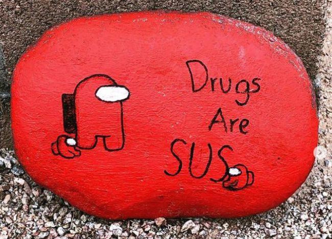 Red Ribbon Week Ideas: Painted Rocks Small rock painted red saying "Drugs are SUS"
