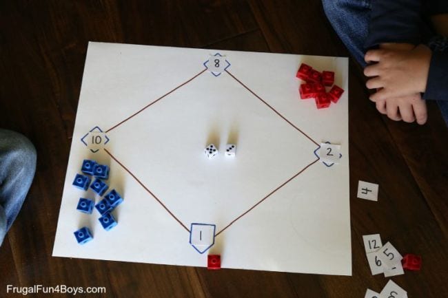 Baseball diamond drawn on a large piece of paper, with numbers at each base and red and blue markers
