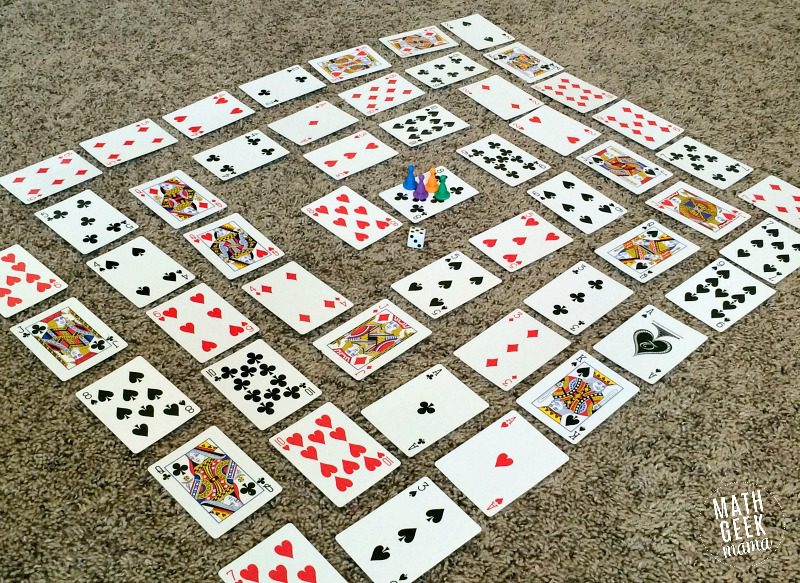 spiral-multiplication-card-Game Playing cards laid out on a table in a spiral