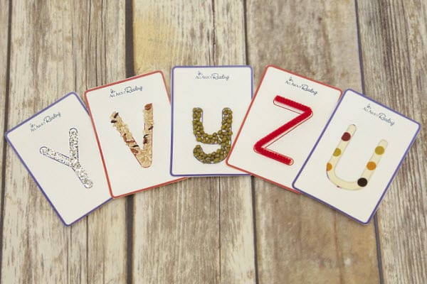 tactile-letter-cards-5-600×400-1 Letter cards with different tactile surfaces laid out on the floor as an example of alphabet activities