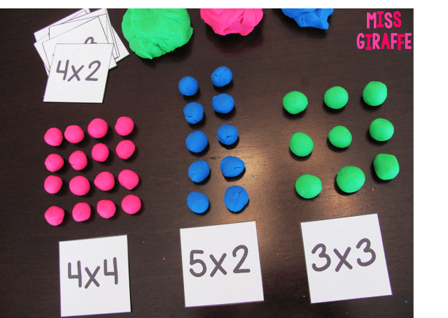 playdough-arrays Colorful balls of play dough laid out in arrays above multiplication problems