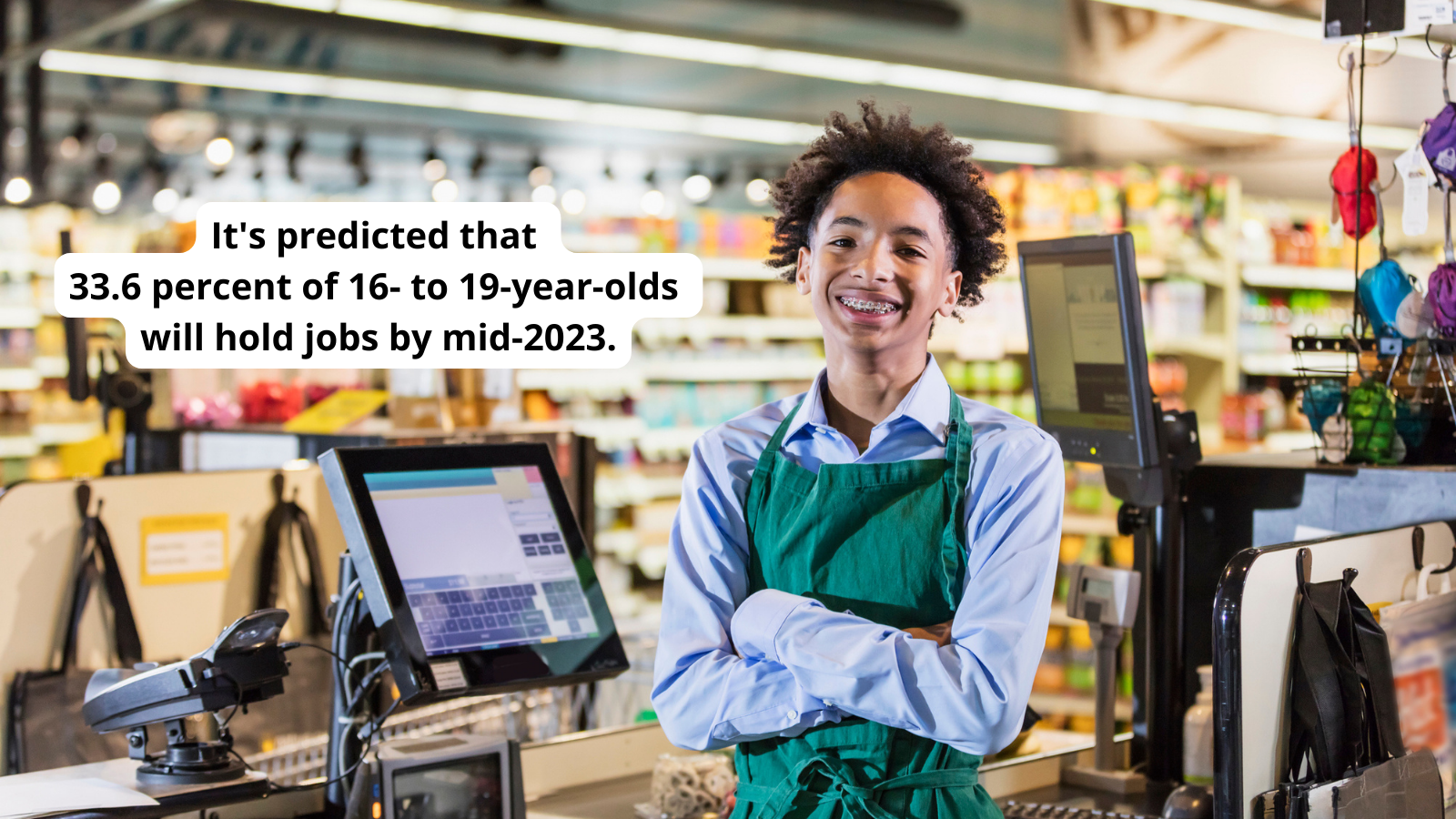 Happy teen smiling while working in grocery store