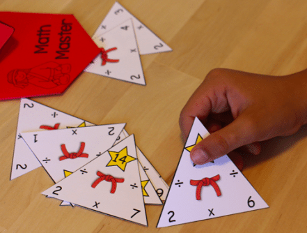 Triangular fact family cards made from card stock used to teach multiplication